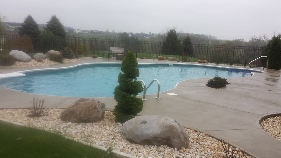 Ivanoff completed inground pool installation with concrete deck by Ahner Pools