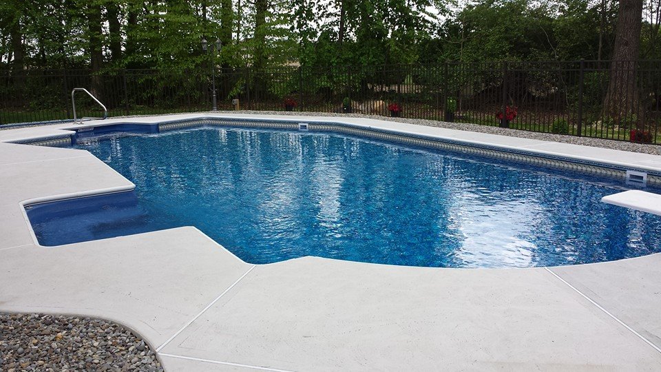 Rindock pool from second angle showing backyard layout and fence integration