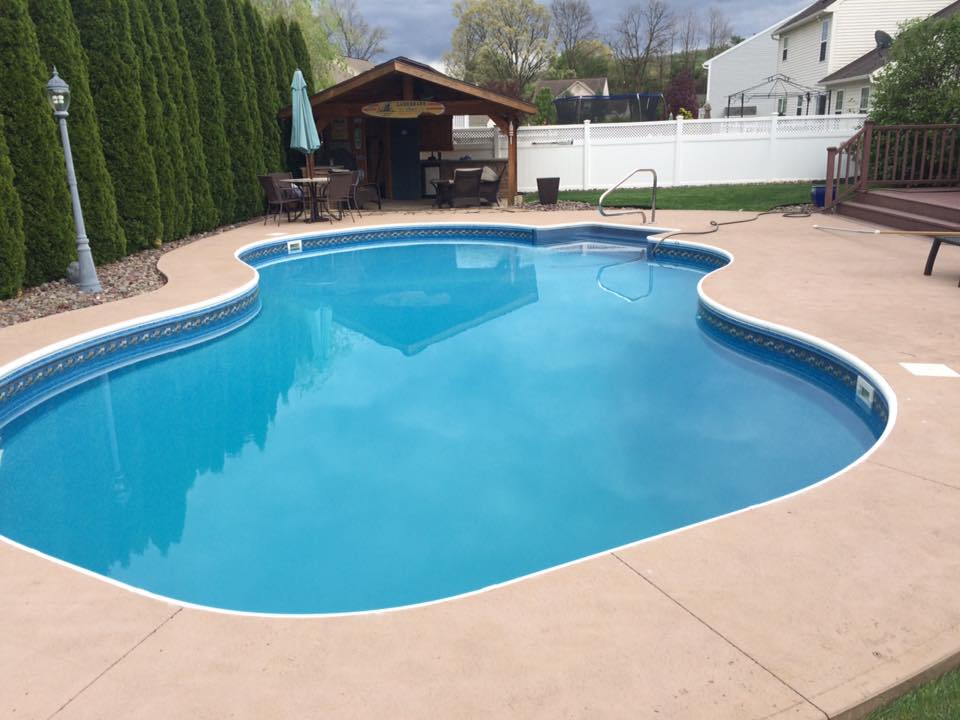 Wessner custom pool project with deck and surrounding landscape by Ahner Pools Unlimited