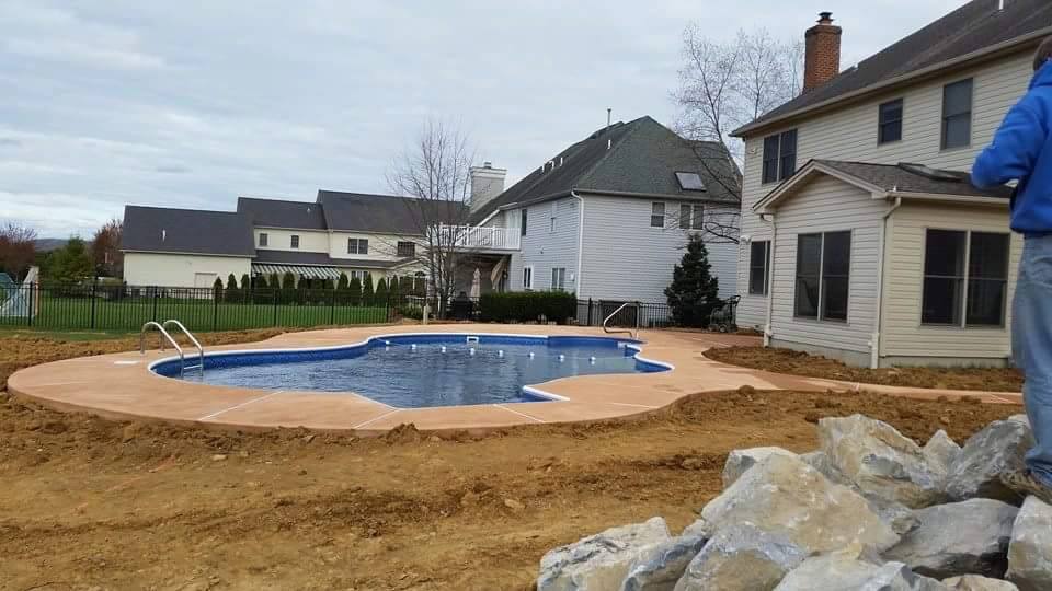 Yocco pool after renovation showing refreshed liner and refinished coping by Ahner Pools